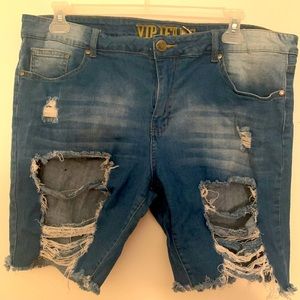 Knee length ripped denim shorts